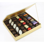 Coffret Ellipse carré garni de 510 g de chocolats Leonidas